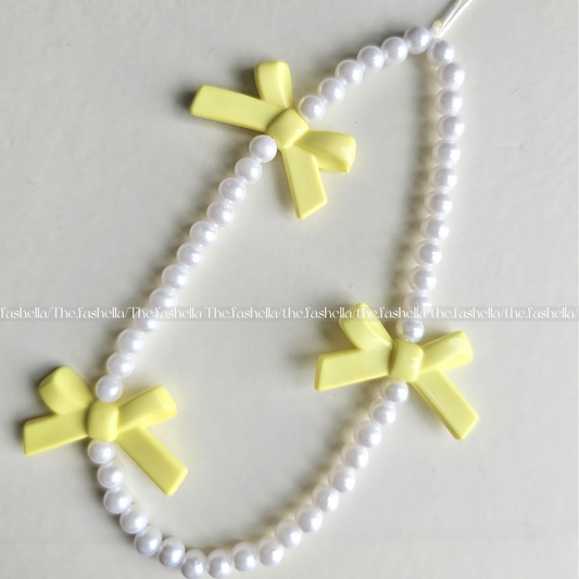 Pretty yellow bow charm