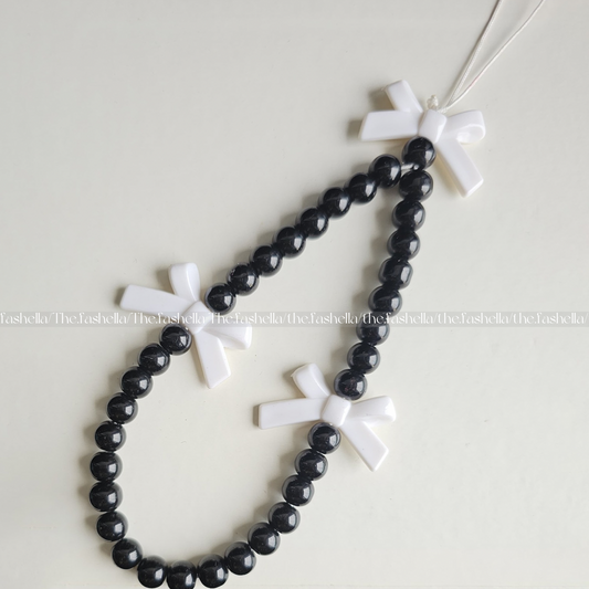 Black beads with white bow charm